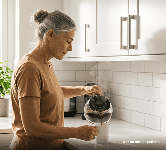 Patient with GEP-NETs pouring coffee at home after treatment.